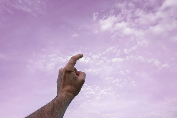 hand up gesturing in the pink sky, feelings and emotions 