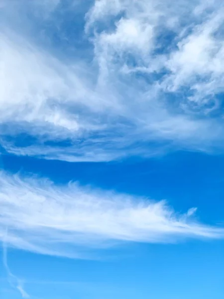 Stunning cirrus cloud formation panorama in a deep blue summer sky seen over Europe