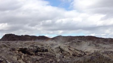 Unreal volcanic landscape in Iceland with steaming rocks on a volcano.