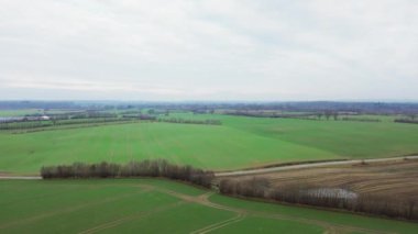 Aerial video of a drone flying over agricultural land in northern Germany