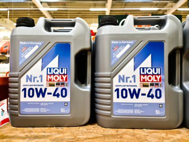 Kiel, Germany - 11 February 2023: Two canisters of Liqui Moly brand motor oil