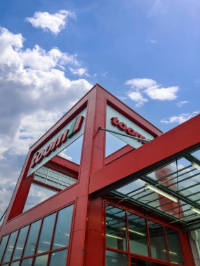 Kiel, Germany - 11 February 2023: Entrance area of the Toom brand furniture store in good weather.