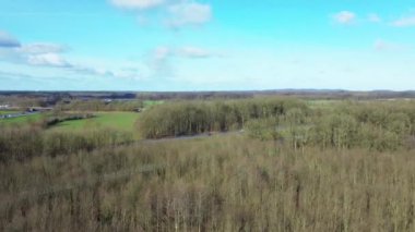 Aerial view of a drone on the A7 motorway in northern Germany between fields and meadows.