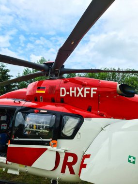 Kiel, Germany - 24.May 2024: View of a stationary red helicopter of the German Air Rescue DRF clipart