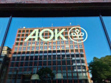 Cologne, Germany - 08 August 2024: The logo of the AOK brand health insurance company in a window clipart