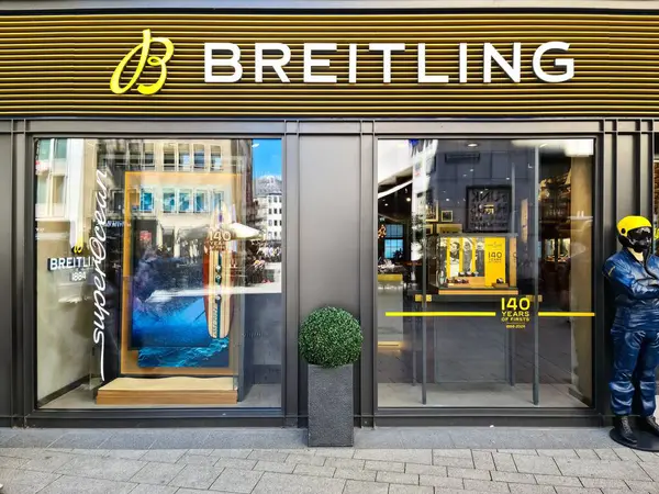 stock image Cologne, Germany - 08 August 2024: The entrance area of a Breitling luxury watch store with the large logo above the store