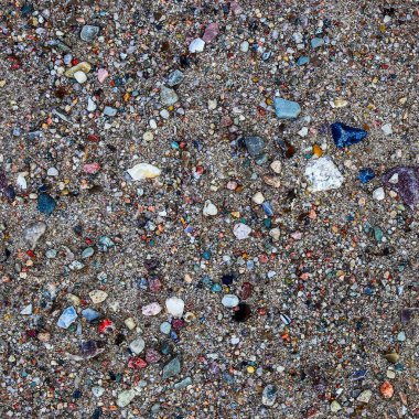 Kusursuz bir doku, yüzeyleri oluşturmak için mükemmel küçük taşları olan bir kum yüzeyi.