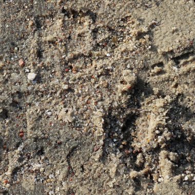 Kusursuz bir doku, yüzeyleri oluşturmak için mükemmel küçük taşları olan bir kum yüzeyi.