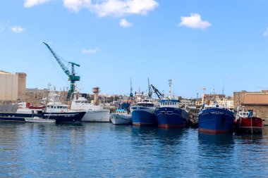 Valletta, Malta: 01. October 2024: Ships and cranes at the docks of the industrial port of Valletta in Malta clipart