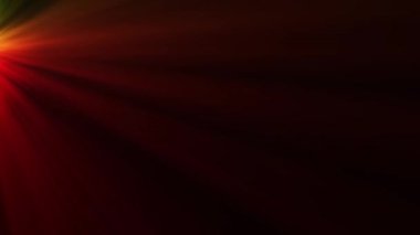 Siyah bir arkaplan üzerinde farklı renklerde ince yapılandırılmış ışık demetleri.