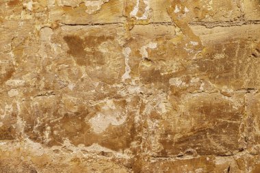 Malta 'nın tarihi şehirlerinin dar sokaklarında eski bir taş duvarın yüzeyi.