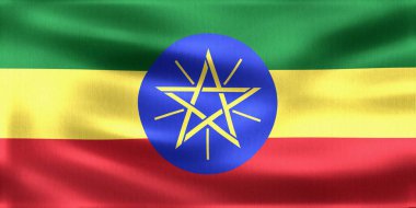 Etiyopya 'nın yeşil, sarı ve kırmızı bayrağı rüzgârda sallanıyor, ortasında mavi bir disk ve sarı bir pentagram var.