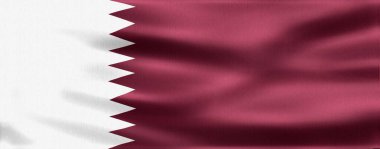 Gerçekçi Katar bayrağı rüzgarda zarifçe sallanıyor ulusal gururunu gösteriyor ve ulusun kimliğini ve bağımsızlığını simgeliyor.