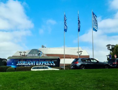 Bochum, Germany - 25. September 2025: Starlight Express musical sign on a train facade in Bochum under a blue sky