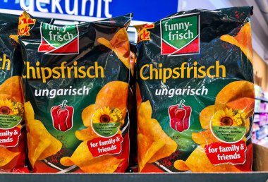 Chipsfrisch Ungarisch potato chips bags on a supermarket shelf, a popular German snack food