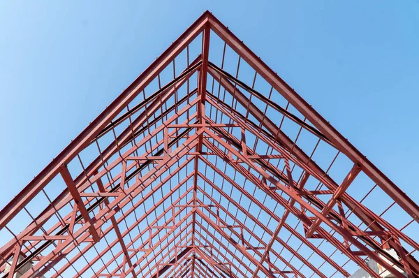 steel frames and trusses of a industrial building. steel frame building project scheme.