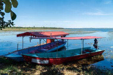 boats serving tourists.The water,the swamp,fog,the mountain,the beautiful sky and cloud at Bueng Khong Long,Seka district,Bung Kan province,Thailand.