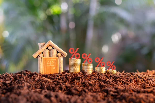 Coins and house. has an illustration of interest concept of calculating interest payments. planning savings money of coins to buy a home concept for property, mortgage, invest.