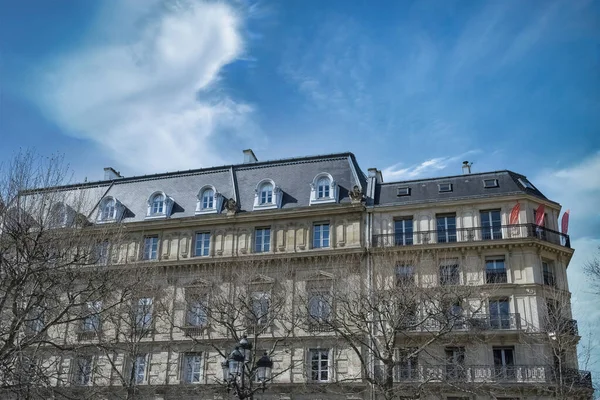 stock image Paris, ancient buildings, typical parisian facades with a lamppost