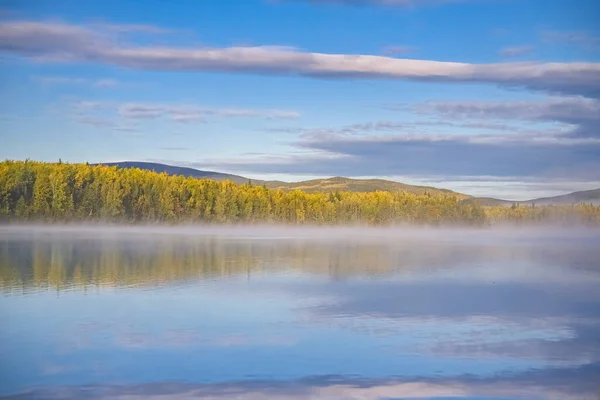 stock image Yukon in Canada, wild landscape in autumn of the Tombstone park, reflection of the trees in a lake