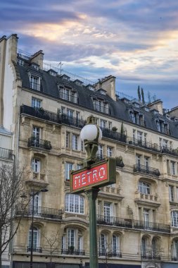 Paris, beautiful buildings boulevard Voltaire in the 11e arrondissement, with a subway sign clipart