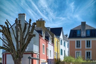 Sauzon in Belle-Ile, Brittany, typical street in the village, with colorful houses clipart