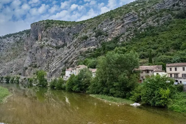 stock image Anduze, French village, houses on the river, porte of the Cevennes