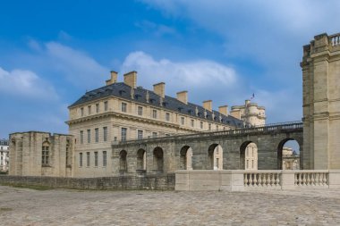 Vincennes in France, the beautiful French royal castle in the center clipart