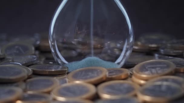 Sand Flows Hourglass Coins Money Surrounding — Vídeos de Stock