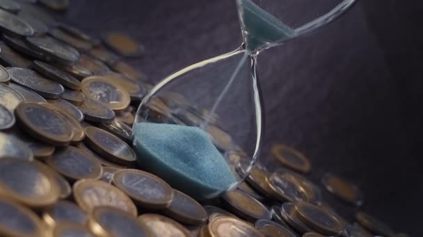 Time Runs Euro Coins Form Glass Hourglass Blue Sand — Vídeos de Stock