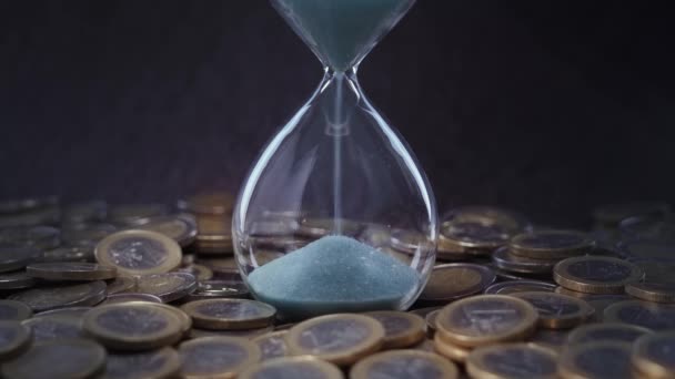 Euro Coins Surround Hourglass Blue Sand Flowing — Video