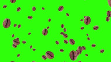 Kahverengi kahve çekirdekleri yeşil zemine düşer