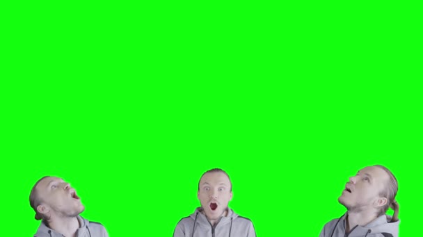 三个男人的脸 在绿色屏幕的底部 复制的空间在顶部 用张开的嘴 看着空旷的空间 做出了非常令人惊讶的表情 — 图库视频影像