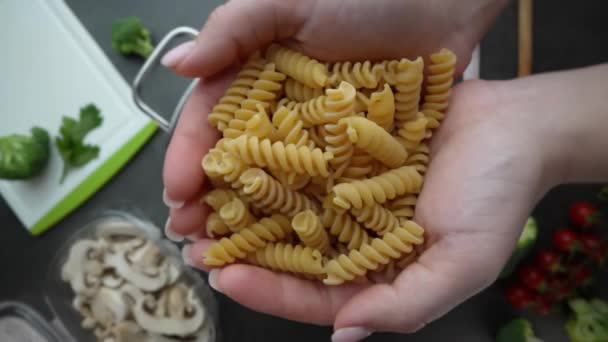 Pasta Dropped Hands Water Pot Kitchen Table Slow Motion Shot — Stock Video