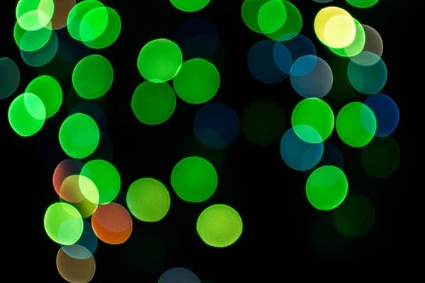 Kerst Gedefocuste Lichten Wazig Kleurrijke Lichten Een Donkere Achtergrond Feestelijke — Stockfoto