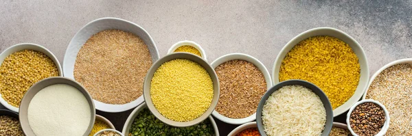 Stock image Various grain cereals in bowls banner, top view