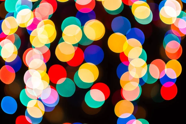 Kerst Gedefocuste Lichten Wazig Kleurrijke Lichten Een Donkere Achtergrond Feestelijke — Stockfoto