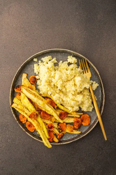 stock image Enjoy a hearty breakfast or lunch with millet, baked zucchini and carrots, for a delicious vegetarian meal