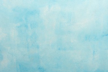 Yaratıcı tasarım, üst görünüm ve kopyalama alanı için yumuşak tonlar ve temiz bir yüzey sunan minimalist yumuşak mavi dokuma arkaplanı