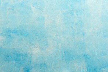 Yaratıcı tasarım, üst görünüm ve kopyalama alanı için yumuşak tonlar ve temiz bir yüzey sunan minimalist yumuşak mavi dokuma arkaplanı