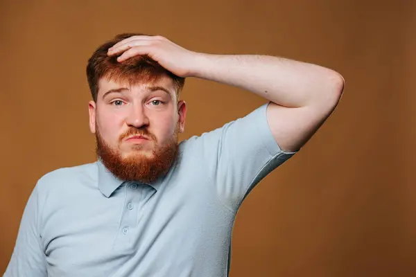 This young adults facial expression is truly remarkable in this studio shot, with an amazed look that will leave you captivated. teenage guys expressive face is captured perfectly in this studio