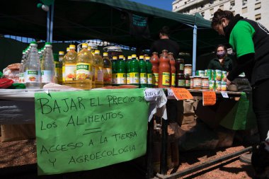 Buenos Aires, Argentina, 21 sept, 2021: UTT, Land Workers Union, sales stand, as part of a day of protest by the organization. Poster text: Lowering the price of food. Access to land and agroecology