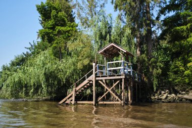Wooden pier in the Tigre delta, in Buenos Aires, Argentina, a quiet tourist place for weekend getaways.