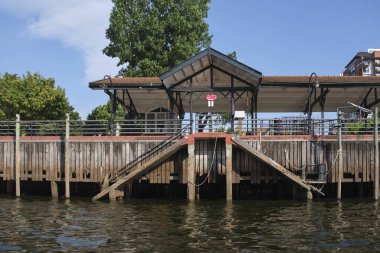 Tigre, Buenos Aires, Argentina, Jan 11 2022: River Station Dock seen from the river. Front view on a sunny summer afternoon.