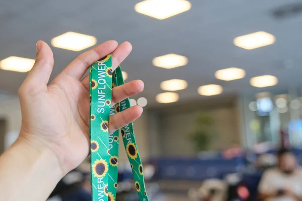 Unrecognizable Person Holding Lanyard Sunflowers Symbol People Invisible Hidden Disabilities Stock Fotó