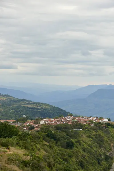 stock image Barichara, the most beautiful town in Colombia, seen from a nearby lookout point, a touristic natural area with great views of the surrounding mountains.