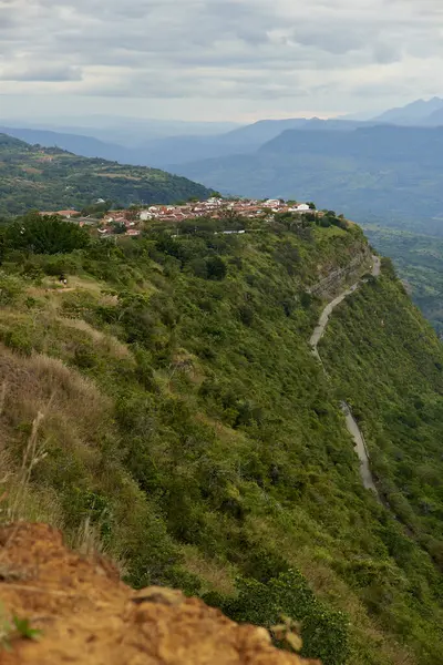 stock image Barichara, the most beautiful town in Colombia, seen from a nearby lookout point, a touristic natural area with great views of the surrounding mountains.