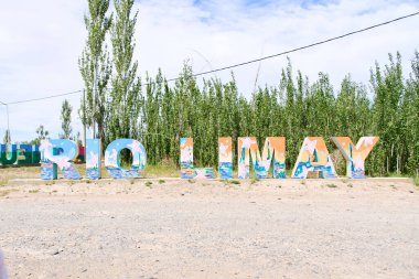 Neuquen, Argentina; Nov 19, 2023: Sign with the text Limay River, signaling the coastal promenade. clipart