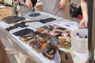 Buenos Aires, Argentina; October 4, 2025: Printing messages of support for social causes during the Flores Book Fair.