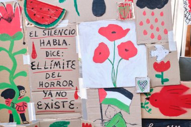 Buenos Aires, Argentina; October 4, 2025: Drawings and messages in support of Palestine displayed during the Flores Book Fair. Text: Silence speaks. It says: the limits of horror no longer exist.